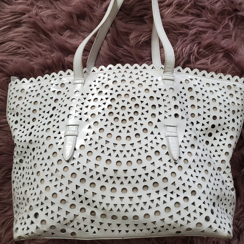 Sondra Robert's white patent leather handbag